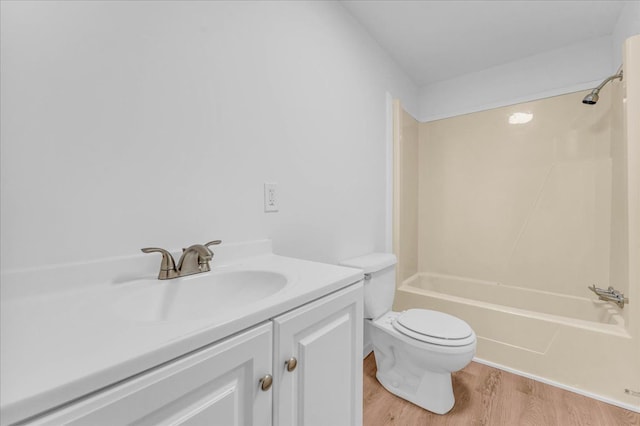 full bathroom with vanity, shower / bathing tub combination, wood finished floors, and toilet