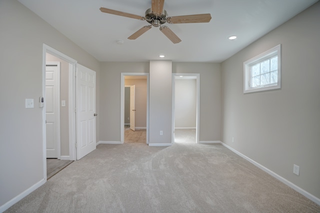 unfurnished bedroom with a spacious closet, baseboards, carpet flooring, recessed lighting, and a ceiling fan