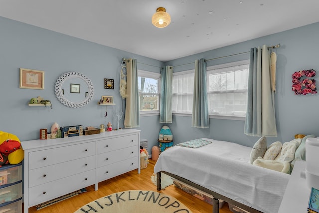 bedroom with light wood-style flooring