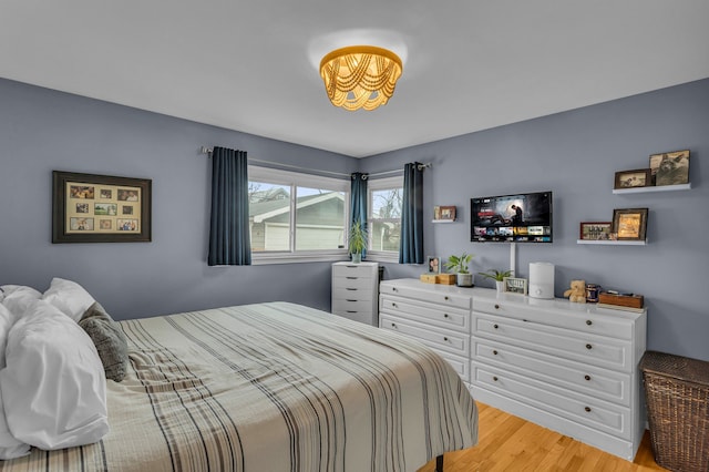 bedroom with light wood-style flooring