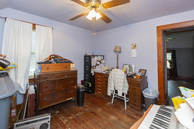 home office with dark wood-style floors and ceiling fan