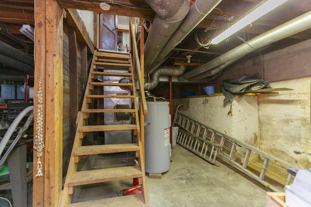 unfinished basement with gas water heater and electric panel