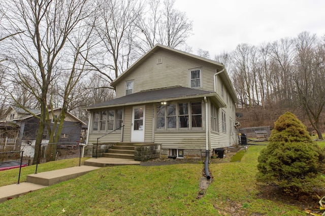 view of front of home with fence and a front yard