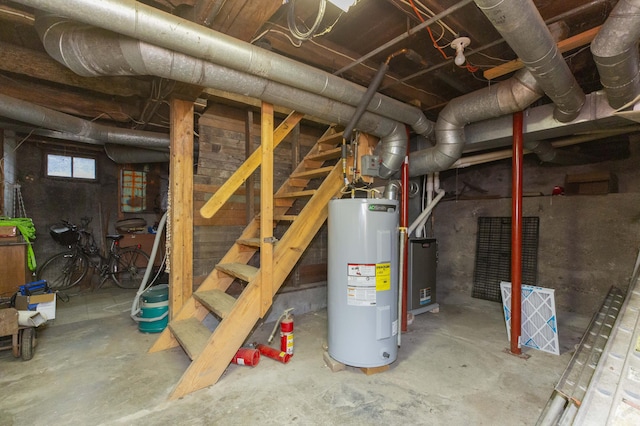 below grade area with stairway and electric water heater