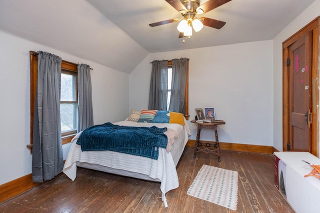 bedroom with ceiling fan, vaulted ceiling, baseboards, and hardwood / wood-style flooring