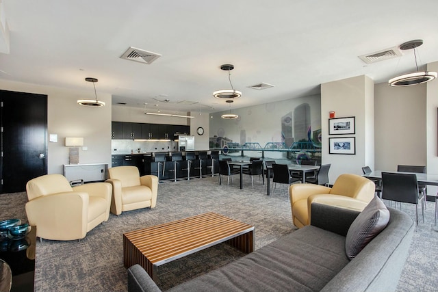 carpeted living room with visible vents