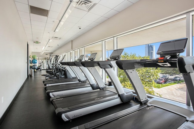 workout area featuring a paneled ceiling and visible vents