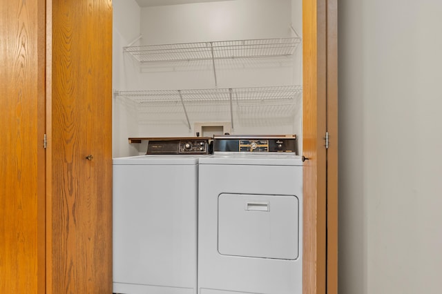 washroom featuring washing machine and dryer and laundry area