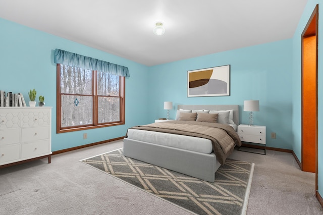 bedroom featuring baseboards and carpet flooring