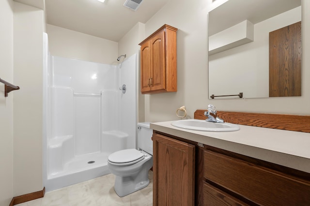 bathroom featuring toilet, visible vents, walk in shower, and vanity