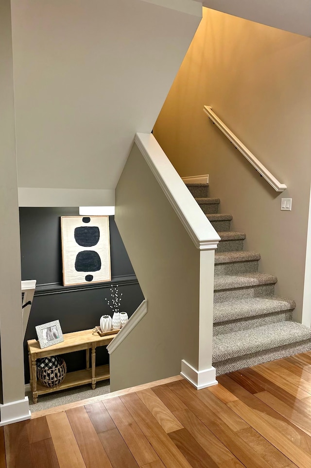 stairway with wood finished floors