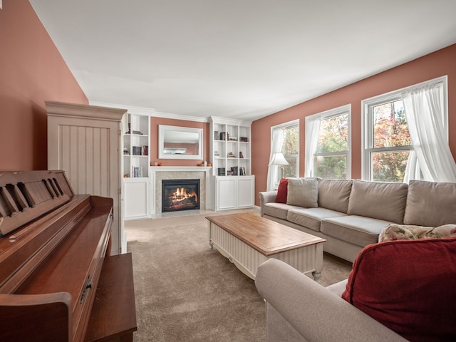 living area featuring a fireplace with flush hearth and light colored carpet