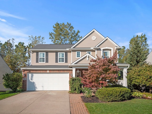 view of front of house featuring driveway, an attached garage, and brick siding