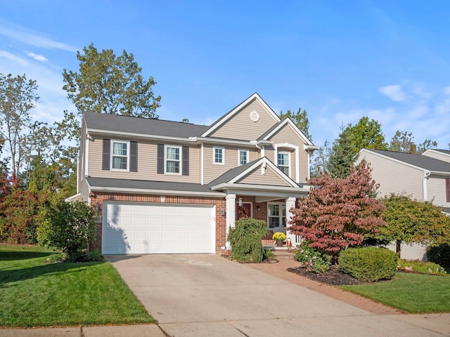 view of front of property featuring a garage, driveway, brick siding, and a front yard