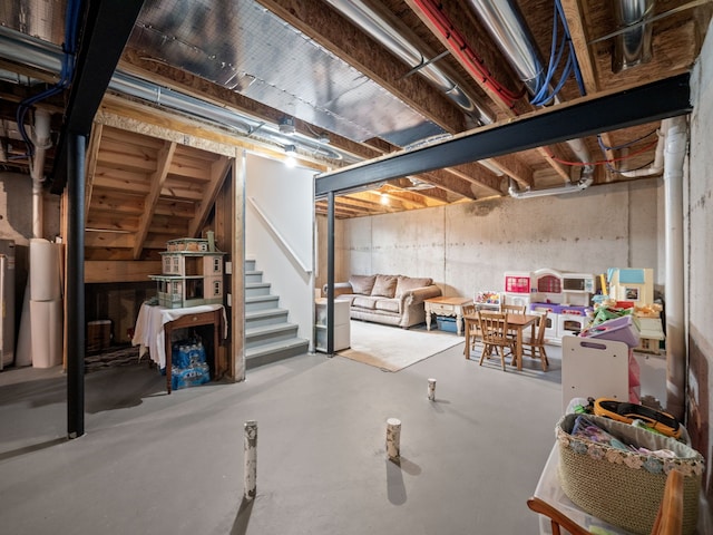 unfinished basement featuring stairs