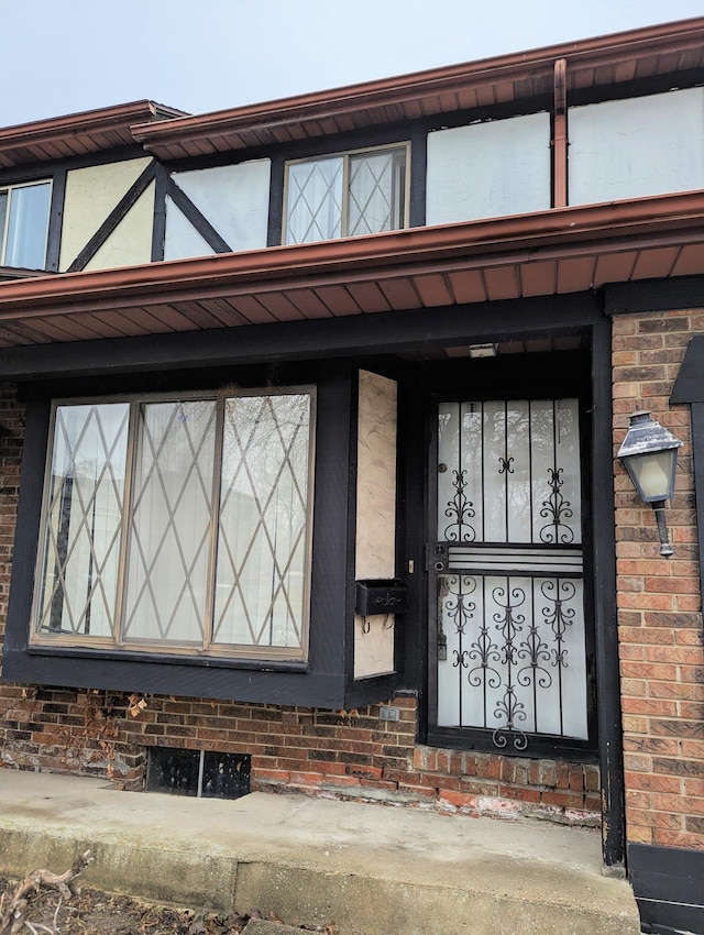 entrance to property with brick siding