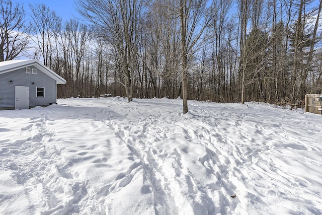 view of yard layered in snow