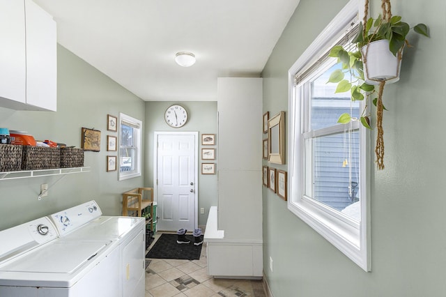 laundry room featuring laundry area, light tile patterned floors, baseboards, and separate washer and dryer