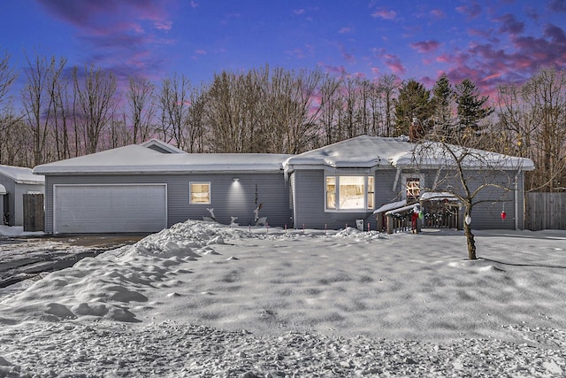 single story home featuring a garage