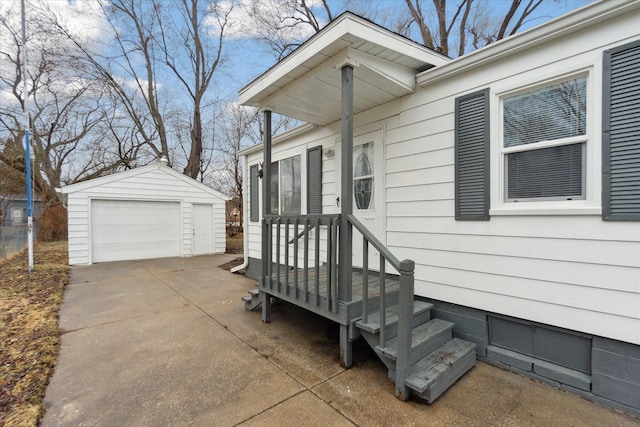 view of home's exterior with a garage and an outbuilding