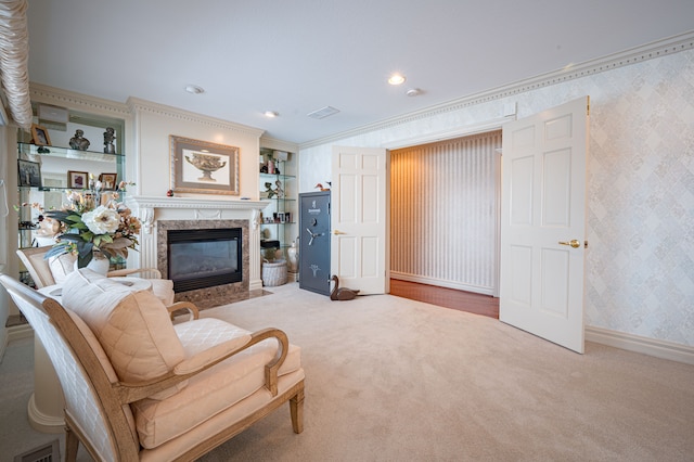 living area featuring baseboards, carpet floors, ornamental molding, and wallpapered walls