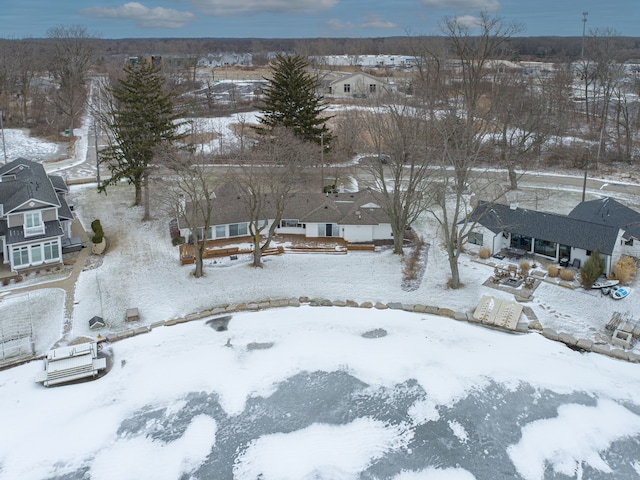 snowy aerial view with a residential view