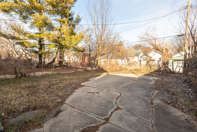 view of yard with a fenced front yard and a residential view