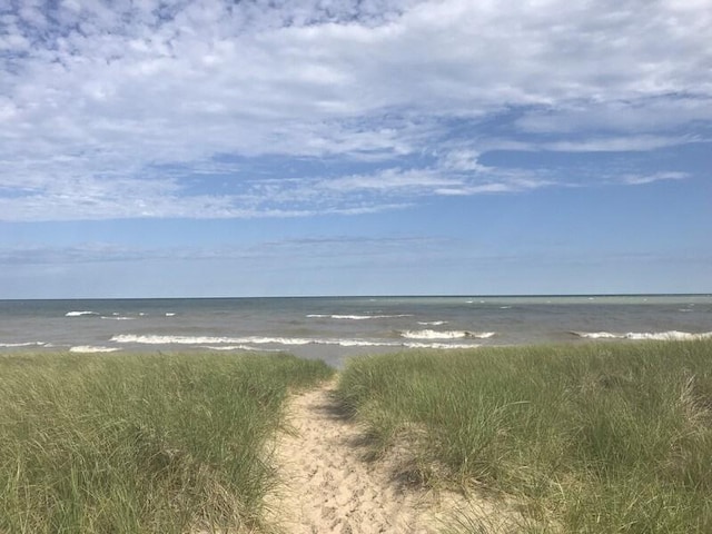 view of water feature with a beach view