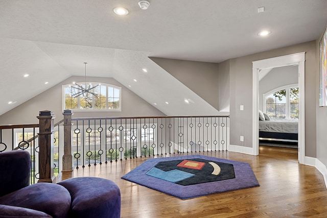 565 Golden Bear Ct, Saint Joseph, MI 49085 - sitting room with wood finished floors, a wealth of natural light, and a notable chandelier