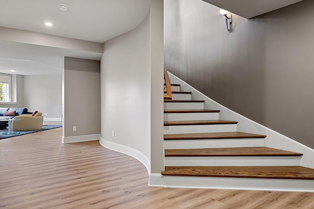 565 Golden Bear Ct, Saint Joseph, MI 49085 - staircase with baseboards, wood finished floors, and recessed lighting