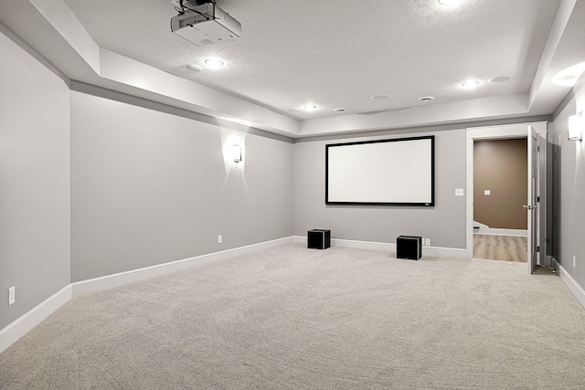 565 Golden Bear Ct, Saint Joseph, MI 49085 - carpeted home theater room with baseboards, a raised ceiling, a textured ceiling, and recessed lighting