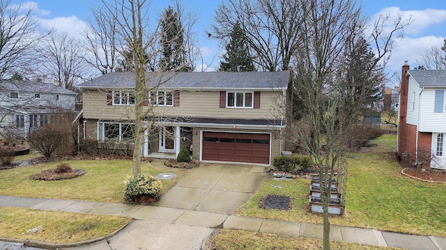 traditional-style house featuring driveway, brick siding, an attached garage, and a front yard