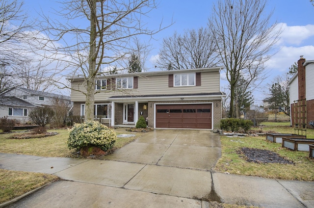 traditional-style home with a garage, a front lawn, concrete driveway, and brick siding