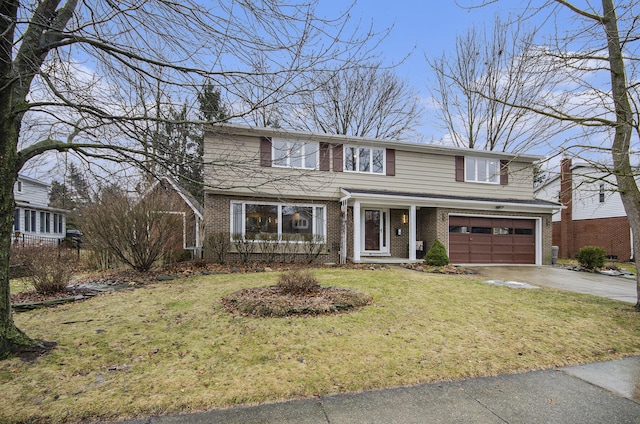 traditional-style house featuring a garage, brick siding, driveway, and a front lawn