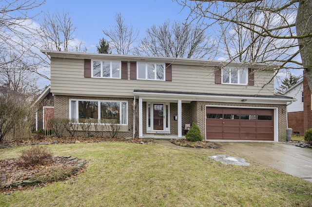 traditional home featuring a garage, driveway, brick siding, and a front yard