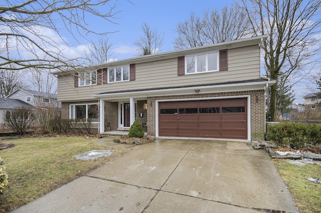 traditional home with a garage, driveway, brick siding, and a front yard