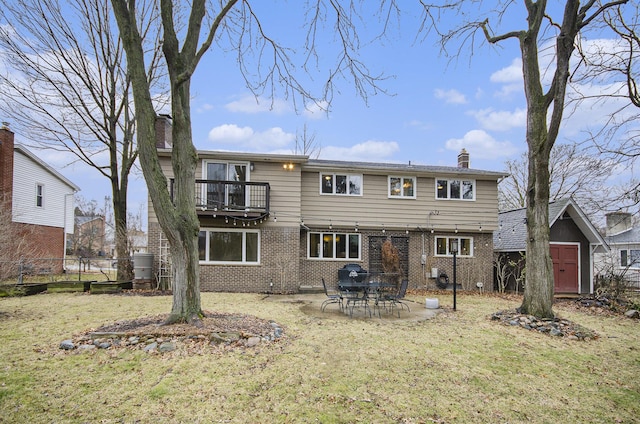 back of property featuring a yard, brick siding, a chimney, and fence