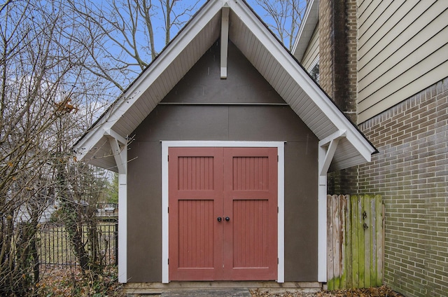 view of shed with fence