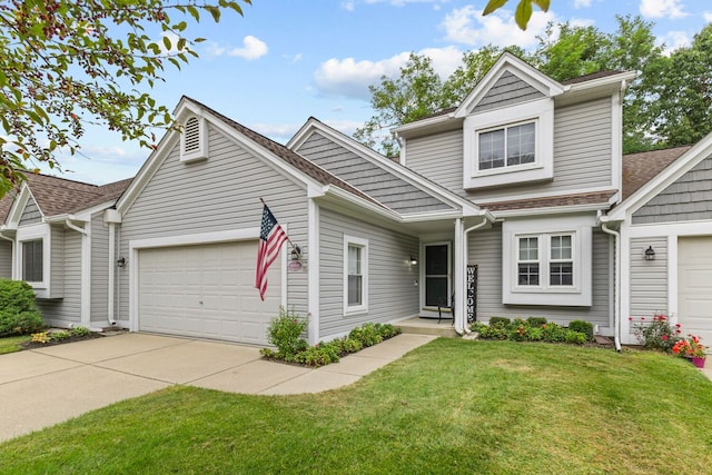 traditional-style home featuring a garage, driveway, and a front yard