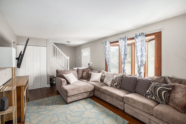 living room featuring stairs and wood finished floors