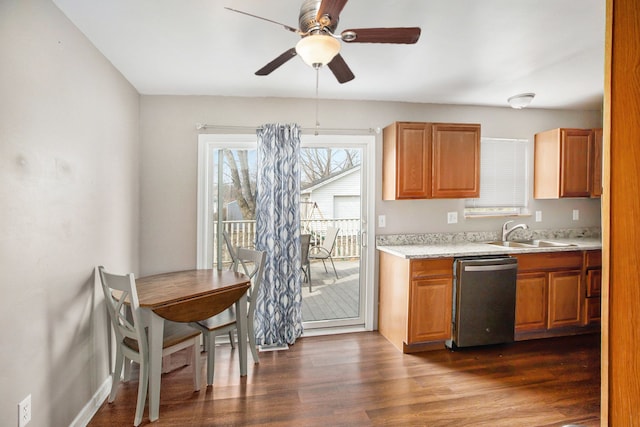 kitchen with ceiling fan, a sink, light countertops, dark wood-type flooring, and stainless steel dishwasher