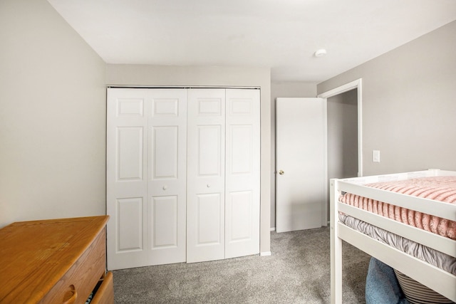 carpeted bedroom with a closet