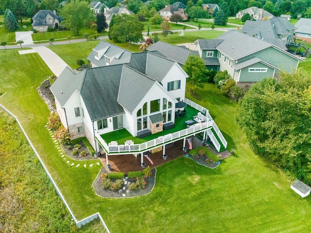 birds eye view of property with a residential view