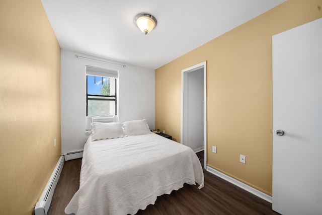 bedroom featuring a baseboard radiator, dark wood-style flooring, and baseboards