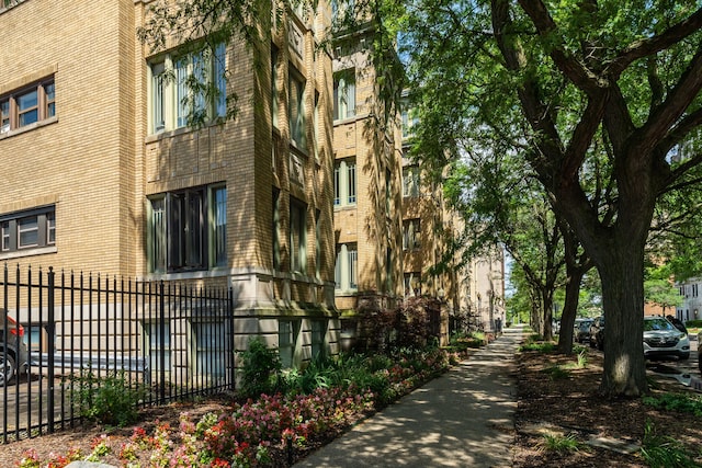 view of building exterior with fence