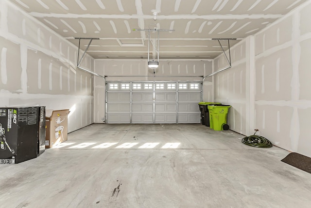 garage featuring a garage door opener