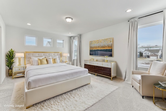 bedroom with multiple windows, carpet flooring, and recessed lighting