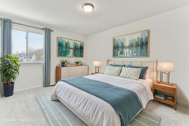 bedroom featuring baseboards and carpet flooring