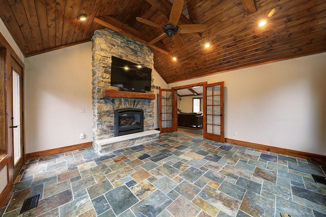 unfurnished living room featuring baseboards, visible vents, wooden ceiling, french doors, and a fireplace