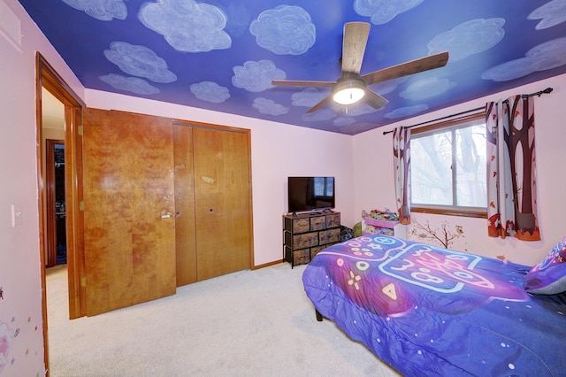 carpeted bedroom with ceiling fan, a closet, and visible vents